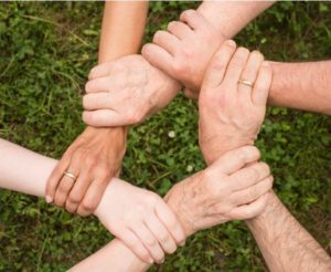 family members holding hands